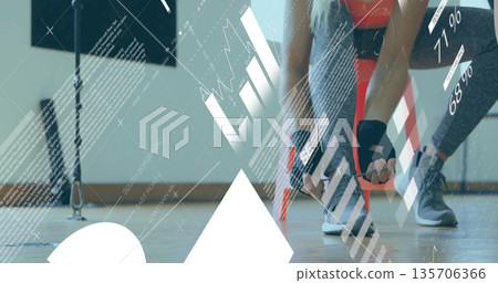 Adjusting athlete fastening shoes and wearing gloves in gym, with cable machine overlay, copy space Adjusting athlete fastening shoes and wearing gloves in gym, with cable machine overlay, copy space 135706366