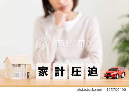 A middle-aged woman struggling with financial pressure A middle-aged woman struggling with financial pressure 135706490