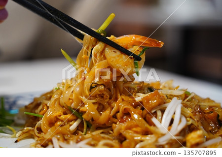 Authentic Thai Pad Thai Stir-Fried Rice Noodles with Shrimp, Bean Sprouts, and Crushed Peanuts Authentic Thai Pad Thai Stir-Fried Rice Noodles with Shrimp, Bean Sprouts, and Crushed Peanuts 135707895