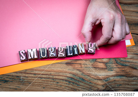 SMUGGLING Illegal Trade And Crime Concept With Wooden Letter Blocks 135708087