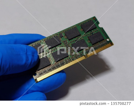Hold one piece of laptop (PC) main memory (RAM) in your hand Hold one piece of laptop (PC) main memory (RAM) in your hand 135708277