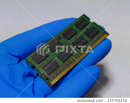 Hold one piece of laptop (PC) main memory (RAM) in your hand Hold one piece of laptop (PC) main memory (RAM) in your hand 135708278