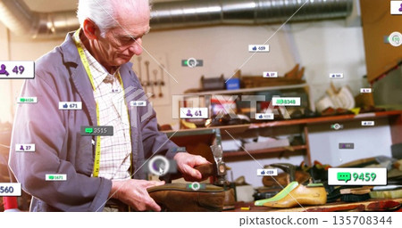 Inspecting shoemaker wearing blue jacket in shoe repair shop, with leather upper and metal last Inspecting shoemaker wearing blue jacket in shoe repair shop, with leather upper and metal last 135708344