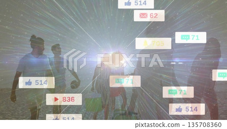 Walking six friends along beach at sunset, with foam boards, beach ball, tote bag, social icons 135708360