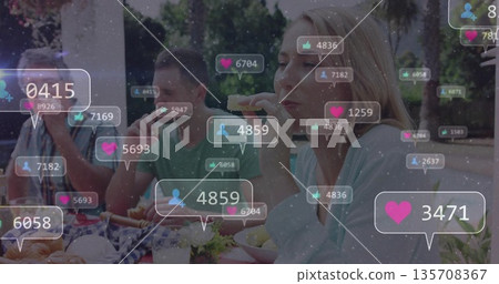 Friends sitting at picnic table in park, eating sandwiches and burgers with floating icon overlays Friends sitting at picnic table in park, eating sandwiches and burgers with floating icon overlays 135708367