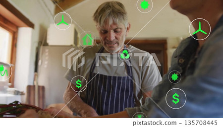 Chopping couple preparing vegetables with knife at home kitchen, with floating sustainability icons Chopping couple preparing vegetables with knife at home kitchen, with floating sustainability icons 135708445