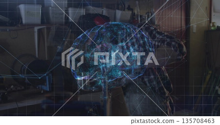 Engineer in plaid shirt studying holographic brain over workbench in lab, with tools and components 135708463