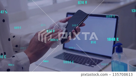 Wiping woman cleaning smartphone with white cloth at home desk, with laptop sanitizer coffee cup Wiping woman cleaning smartphone with white cloth at home desk, with laptop sanitizer coffee cup 135708613