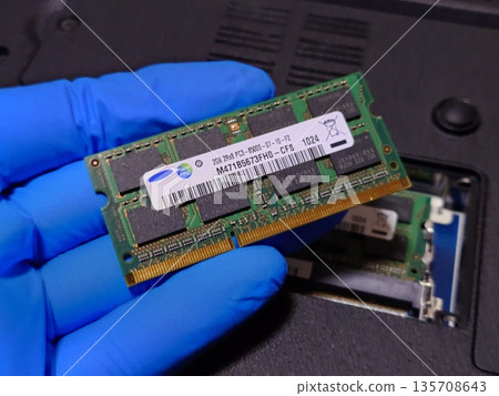 Hold one piece of laptop (PC) main memory (RAM) in your hand Hold one piece of laptop (PC) main memory (RAM) in your hand 135708643