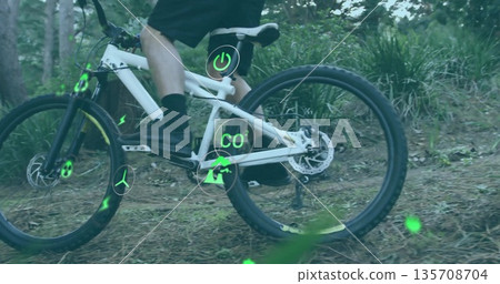 Riding cyclist wearing sportswear pedaling forest trail, with electric mountain bike and eco-icons Riding cyclist wearing sportswear pedaling forest trail, with electric mountain bike and eco-icons 135708704