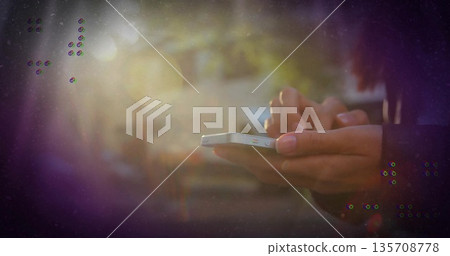 Holding Asian woman wearing jacket touching white smartphone screen on sunlit street, copy space 135708778