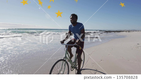Bicycling man wearing red shorts and blue shirt along shoreline, yellow star overlays, copy space 135708828