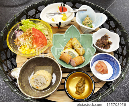 Japanese cuisine served on small plates in a basket 135708956