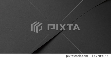 Dark black paper background with matte surface and fine material. Minimalistic premium space in chic Dark black paper background with matte surface and fine material. Minimalistic premium space in chic 135709133