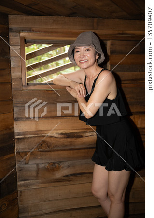 A woman relaxing in a sauna in Yatsugatake, Yamanashi 135709407