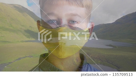 Blending boy portrait with mountain lake landscape, featuring yellow mask and blue shirt Blending boy portrait with mountain lake landscape, featuring yellow mask and blue shirt 135709513