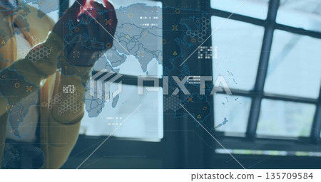 Pressing pointer with red work glove on map interface with overlays in command center, copy space 135709584