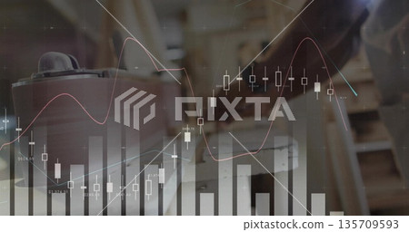 Using analyst's hands scrolling smartphone and typing laptop in home office with charts, copy space 135709593