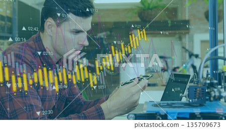 Man wearing red plaid shirt examining component in workshop with 3D printer and financial overlay Man wearing red plaid shirt examining component in workshop with 3D printer and financial overlay 135709673