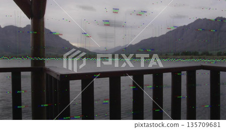 Framing wooden deck railing guiding gaze across calm lake water, with distant mountain range behind Framing wooden deck railing guiding gaze across calm lake water, with distant mountain range behind 135709681