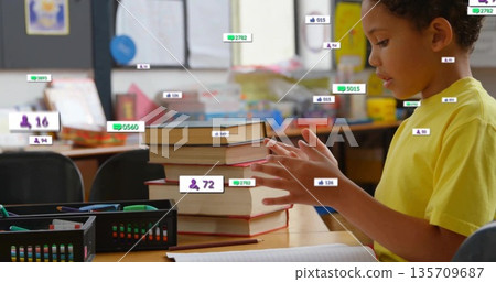 Organizing student wearing yellow T-shirt sorting books and baskets at school desk, copy space Organizing student wearing yellow T-shirt sorting books and baskets at school desk, copy space 135709687