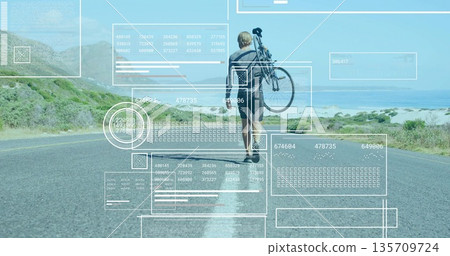 Walking mid-adult man carrying bicycle over shoulder on coastal highway road, with data overlays Walking mid-adult man carrying bicycle over shoulder on coastal highway road, with data overlays 135709724