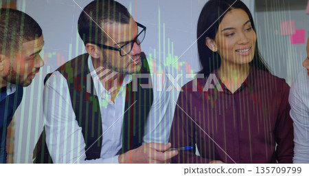 Discussing team wearing business clothes at office desk, with sticky notes, financial chart overlay 135709799