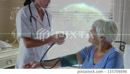 Measuring nurse holding blood pressure cuff on senior patient arm in home, with stethoscope 135709890