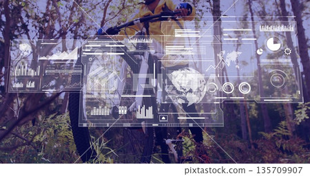 Standing cyclist wearing yellow jacket holding mountain bike on forest trail, with digital panels Standing cyclist wearing yellow jacket holding mountain bike on forest trail, with digital panels 135709907