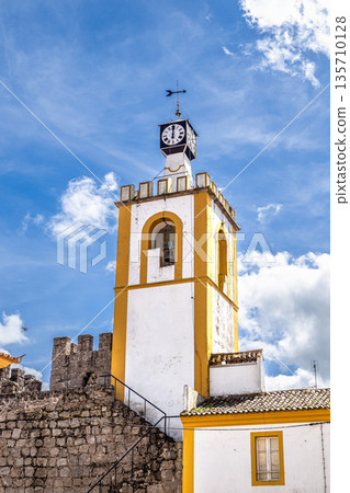The Castelo de Nisa with the clock Tower, Torre do Relogio in the old Town of Nisa in Alentejo, Portugal The Castelo de Nisa with the clock Tower, Torre do Relogio in the old Town of Nisa in Alentejo, Portugal 135710128