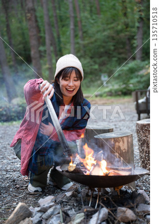 A woman enjoying the outdoors A woman enjoying the outdoors 135710518