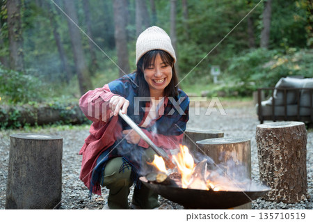 A woman enjoying the outdoors A woman enjoying the outdoors 135710519