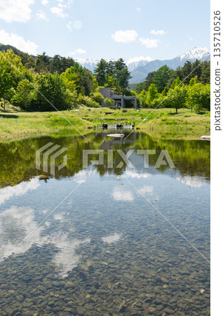 Azumino City, Nagano Prefecture, Alps Azumino National Government Park: A beautiful, clear pond reflecting the fresh greenery and the Northern Alps Azumino City, Nagano Prefecture, Alps Azumino National Government Park: A beautiful, clear pond reflecting the fresh greenery and the Northern Alps 135710526