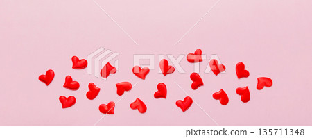 Valentine day background with red hearts, top view with copy space Valentine day background with red hearts, top view with copy space 135711348