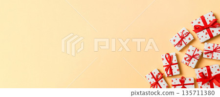 Top view colorful valentine background made of gift boxes with red hearts. Valentine's Day concept with copy space 135711380