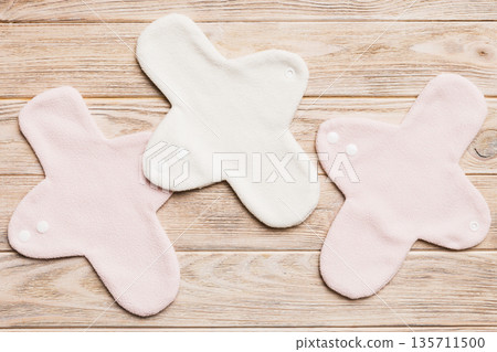 Eco-friendly reusable fabric women's pads. set of colorful bright reusable menstrual pads. zero waste woman periods concept top view with copy space 135711500