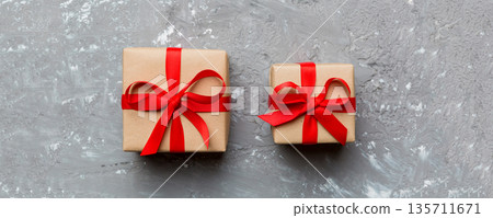 Valentine day composition Background: red gift box with bow and heart. Christmas present. View from above. Holday greeting card 135711671