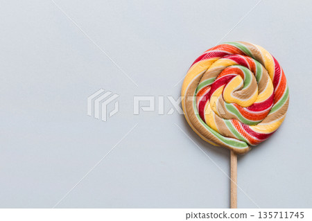 Set of colorful lollipops on colored background. Summer concept. Party Happy Birthday or Minimalist Concept Set of colorful lollipops on colored background. Summer concept. Party Happy Birthday or Minimalist Concept 135711745
