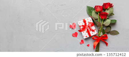 Valentine's day composition with rose flower, red heart and gift boxes on table. mother day and birthday greeting, copy space, top view 135712412
