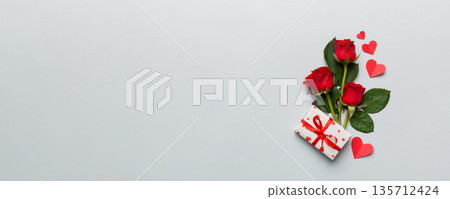 Valentine's day composition with rose flower, red heart and gift boxes on table. mother day and birthday greeting, copy space, top view 135712424