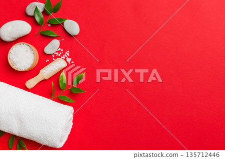 Coconut with jars of coconut oil and cosmetic cream on colored background. Top view. Free space for your text. Natural spa coconut cosmetics and organic treatment concept Coconut Spa composition Coconut with jars of coconut oil and cosmetic cream on colored background. Top view. Free space for your text. Natural spa coconut cosmetics and organic treatment concept Coconut Spa composition 135712446