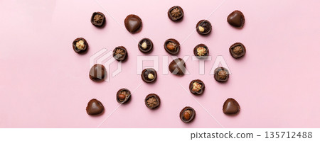 Different kinds of chocolates on colored table close-up. Top View and Flat Lay Different kinds of chocolates on colored table close-up. Top View and Flat Lay 135712488