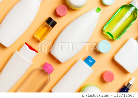 Group of plastic bodycare bottle Flat lay composition with cosmetic products on colored background empty space for you design. Set of White Cosmetic containers, top view with copy space Group of plastic bodycare bottle Flat lay composition with cosmetic products on colored background empty space for you design. Set of White Cosmetic containers, top view with copy space 135712565