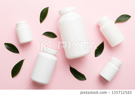 supplement pills with medicine bottle health care and medical top view. Vitamin tablets. Top view mockup bottle for pills and vitamins with green leaves, natural organic bio supplement, copy space supplement pills with medicine bottle health care and medical top view. Vitamin tablets. Top view mockup bottle for pills and vitamins with green leaves, natural organic bio supplement, copy space 135712583