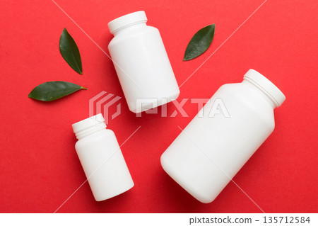 supplement pills with medicine bottle health care and medical top view. Vitamin tablets. Top view mockup bottle for pills and vitamins with green leaves, natural organic bio supplement, copy space supplement pills with medicine bottle health care and medical top view. Vitamin tablets. Top view mockup bottle for pills and vitamins with green leaves, natural organic bio supplement, copy space 135712584