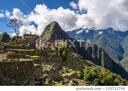 Panoramic view of Machu Picchu ruins with Huayna Picchu in background, Peru Panoramic view of Machu Picchu ruins with Huayna Picchu in background, Peru 135712740