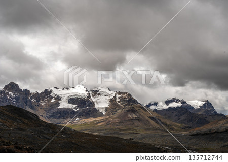 Stone trail leading to Pastoruri Glacier, Huaraz, Peru, amidst rugged mountains Stone trail leading to Pastoruri Glacier, Huaraz, Peru, amidst rugged mountains 135712744