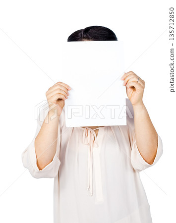 Blank white sheet of paper being held against seamless white studio backdrop, copy space Blank white sheet of paper being held against seamless white studio backdrop, copy space 135712850