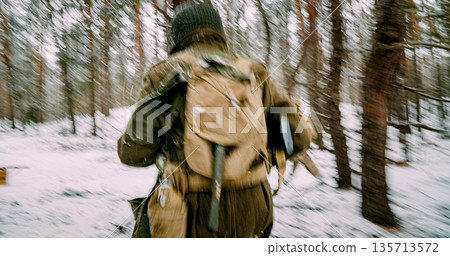 Re-enactor Dressed As American Infantry Soldier Fast Running By Forest In Cold Winter Day. Soldier Retreats From Enemy Attack. Usa Army Soldiers Of World War Ii. Will To Life. Heroes Of War. Chasing 135713572