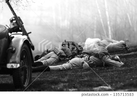 Re-enactor Dressed As Soviet Russian Soldier Lies Slain In Reconstruction Of Battles World War I Near Combat Sidecar. Soviet Russian Infantry Soldier In World War Ii. Black And White Video 135713583